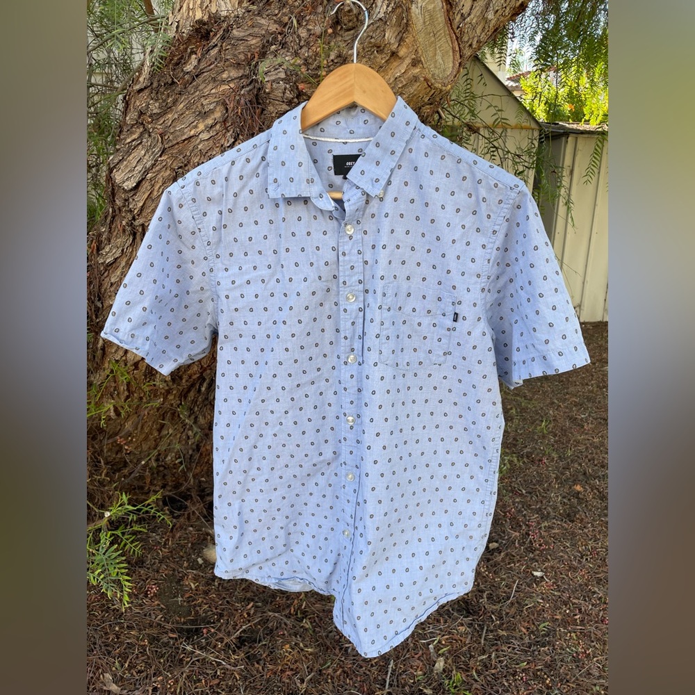Blue Obey short-sleeve button up shirt.